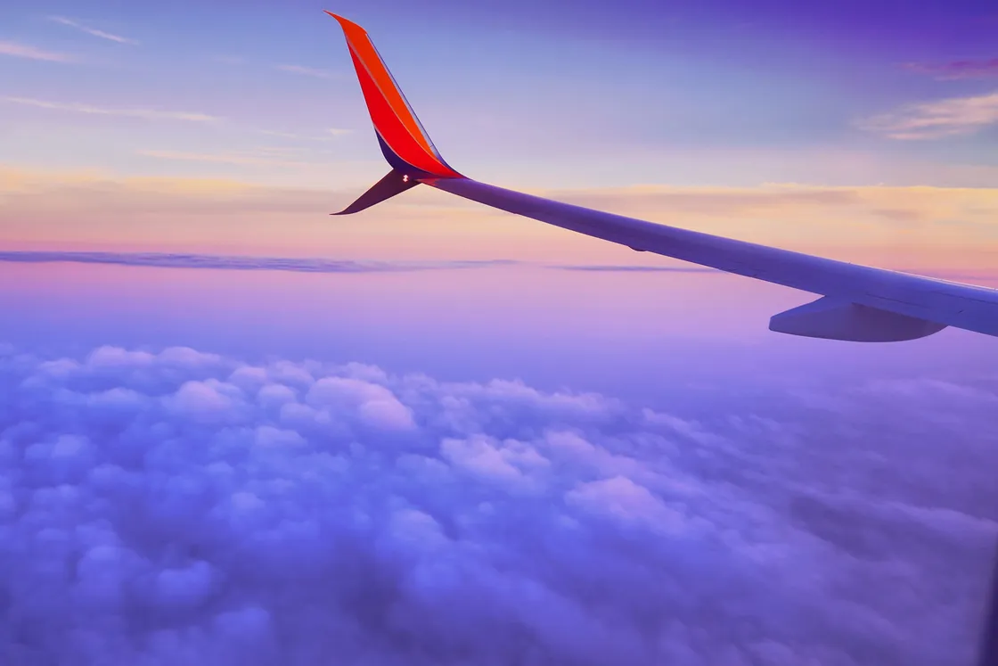 Airplane wing above the clouds — growth trajectory
